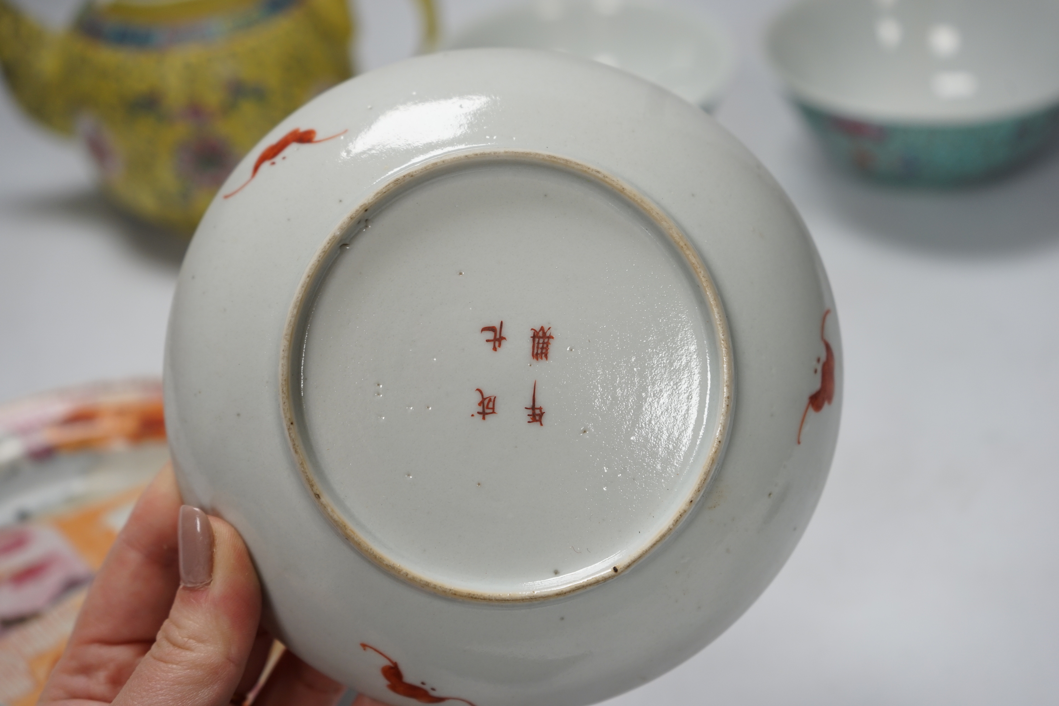 Six Chinese ceramic items; a teapot, two bowls and three small dishes, teapot 10cm
